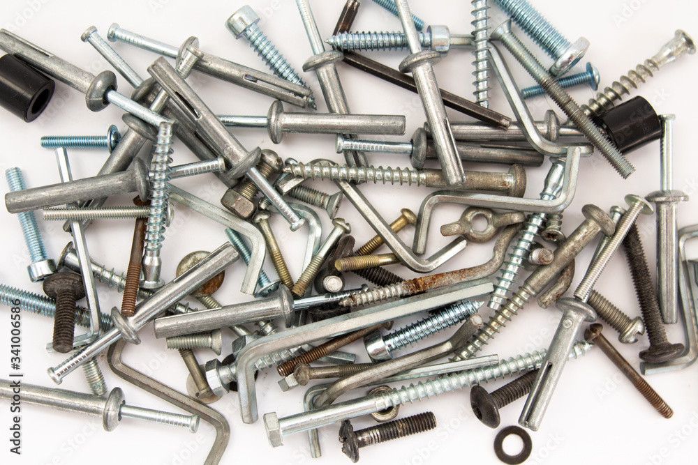 bolts and nuts on a white background in a heap bolts and nuts on a white background in a heap