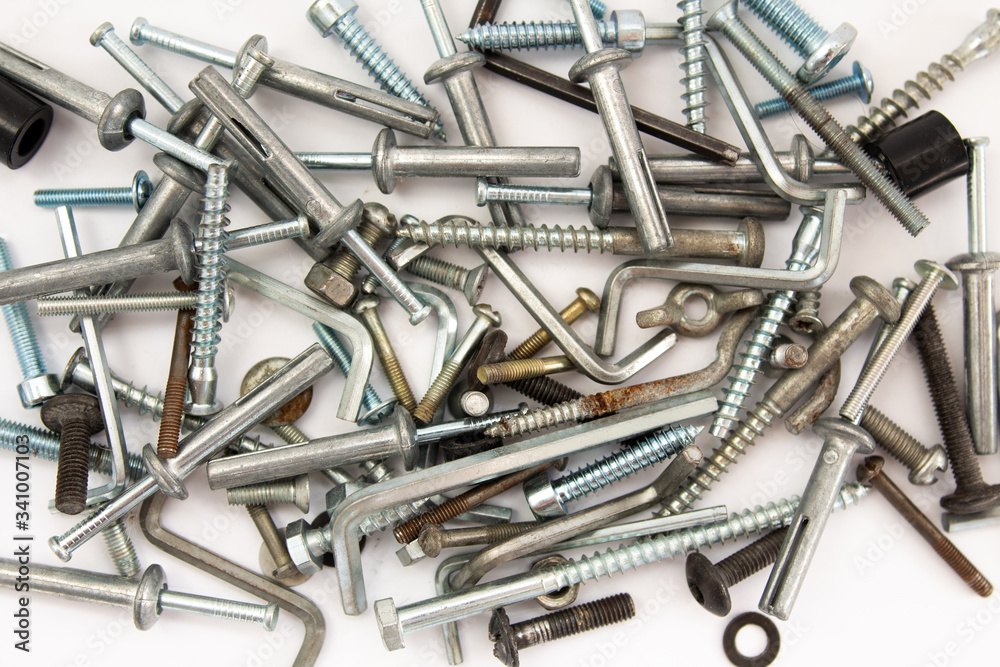 bolts and nuts on a white background in a heap bolts and nuts on a white background in a heap