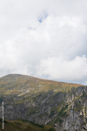 Rocky mountains and beautiful sky. Place for text photo