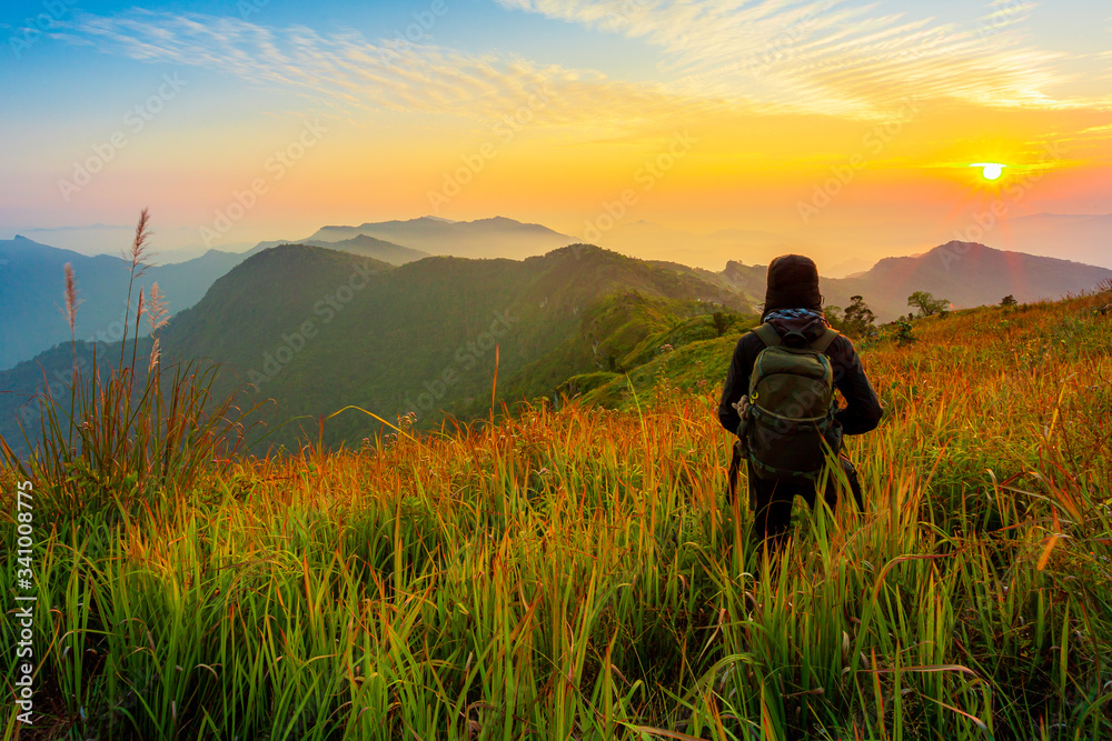 Man's silhouette on sunset mountains backdrop Man's silhouette on sunset mountains backdrop