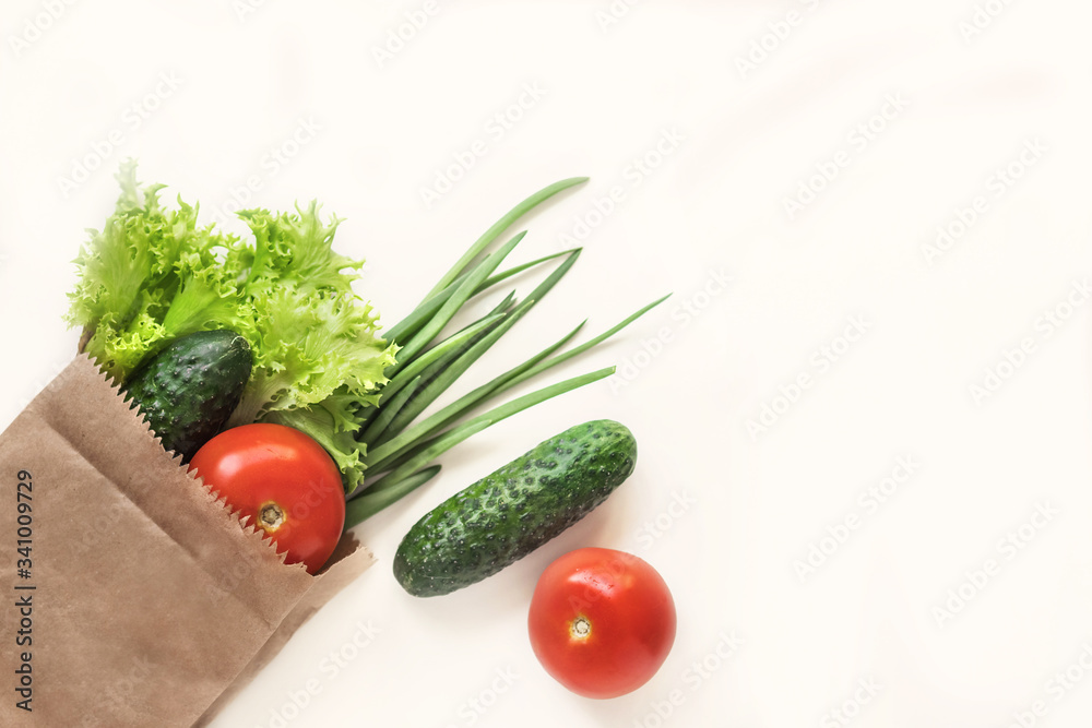 Food delivery. Fresh vegetables. Healthy healthy food.Paper bag with vegetables and other foodstuffs on a white background with copy space top view.. Food delivery. Fresh vegetables. Healthy healthy food.Paper bag with vegetables and other foodstuffs on a white background with copy space top view..