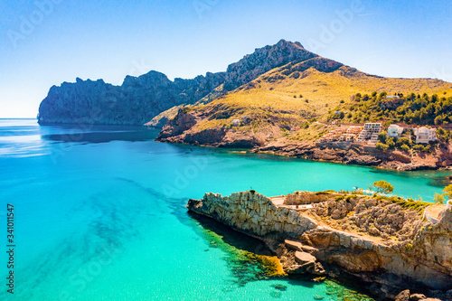 Cala San Vicente on a wonderful sunny day with crystal clear waters.