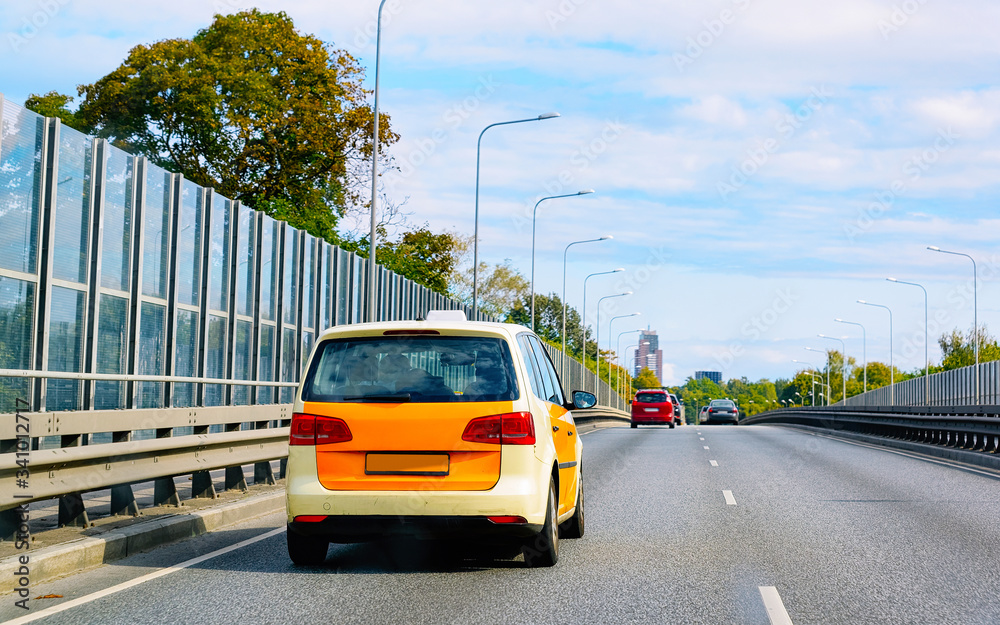 Obraz premium Taxi car on road in Jurmala reflex