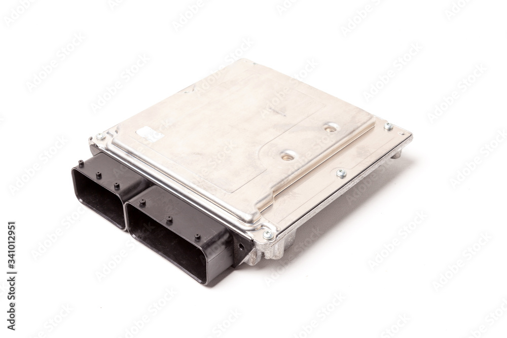 Plastic car engine control unit with metal elements on a white isolated background - the connecting center of different subsystems, nodes and aggregates. Plastic car engine control unit with metal elements on a white isolated background - the connecting center of different subsystems, nodes and aggregates.