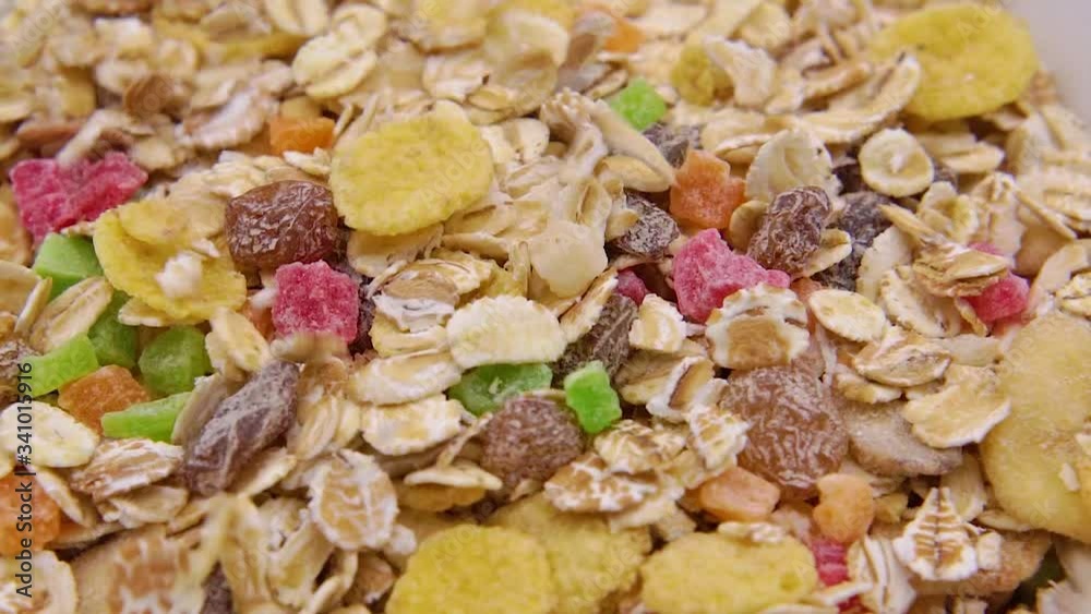 Close-up of muesli poured in a white bowl Close-up of muesli poured in a white bowl