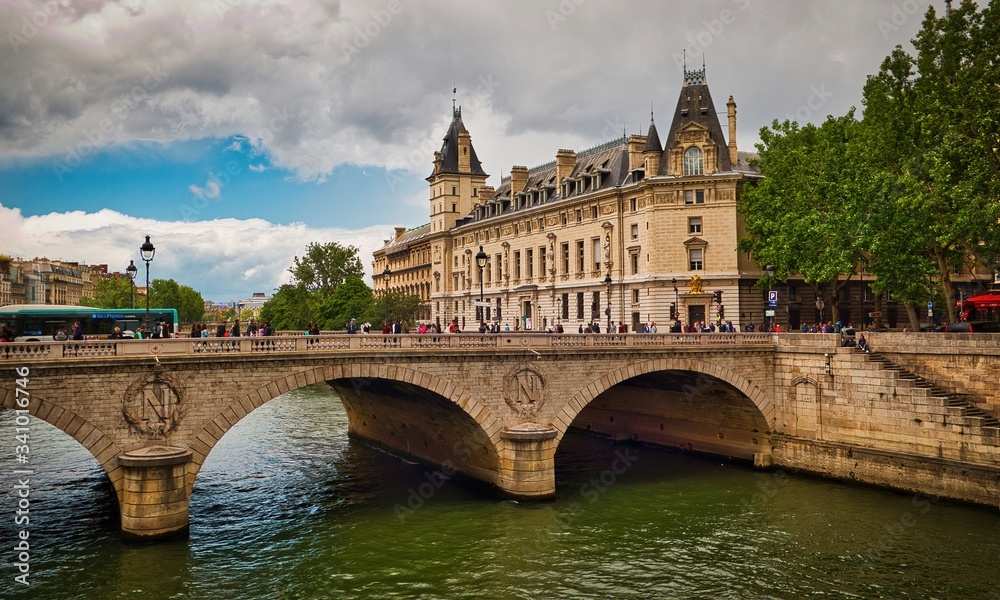 Bridge Pont Saint-Michel across Seine River and beautiful historic buildings of Paris