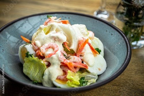 Roman lettuce salad with Caesar sauce, prawns