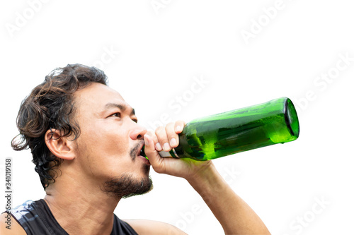 Isolated green beer bottle in the hand of asian man on a white background with clipping path..