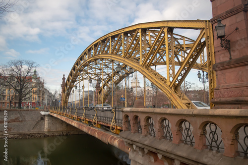 Bridge Most Zwierzyniecka with yellow metalic structure in Wroclaw, Poland. © Maria