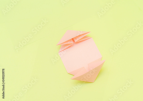 Origami pink heart on a green background, step by step instructions. as great idea for a hand made diy Valentine s Day, Mothers day gift. Step 7