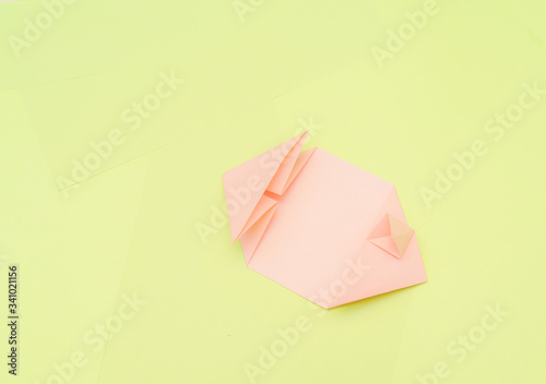 Origami pink heart on a green background, step by step instructions. as great idea for a hand made diy Valentine s Day, Mothers day gift. Step 9