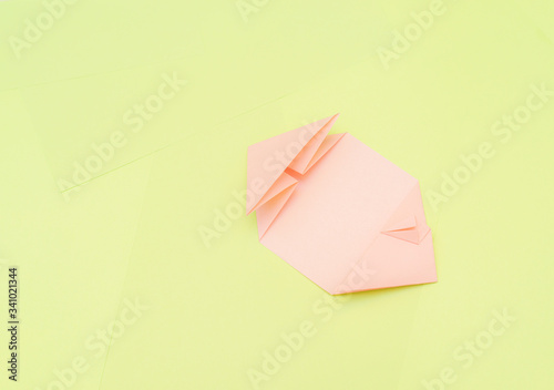Origami pink heart on a green background, step by step instructions. as great idea for a hand made diy Valentine s Day, Mothers day gift. Step 11