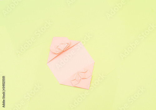 Origami pink heart on a green background, step by step instructions. as great idea for a hand made diy Valentine s Day, Mothers day gift. Step 13