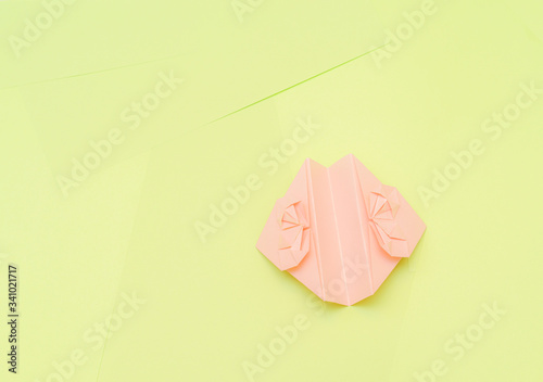 Origami pink heart on a green background, step by step instructions. as great idea for a hand made diy Valentine s Day, Mothers day gift. Step 16