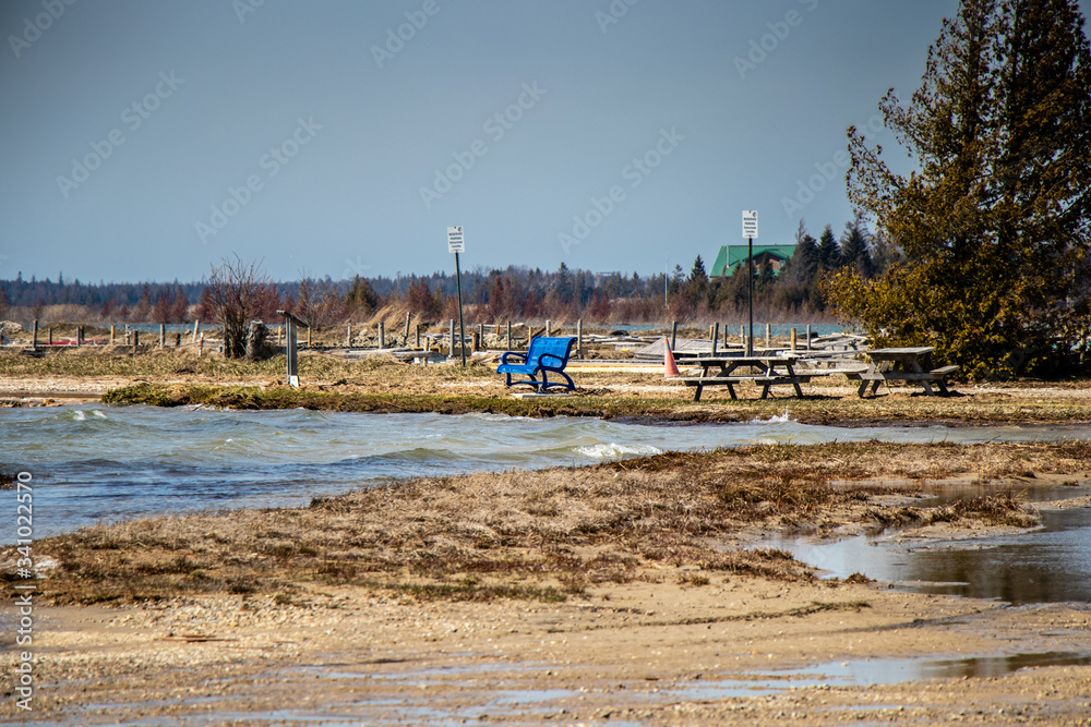 High water flooding the beach and docks at Oliphant on Lake Huron, Ontario, Canada