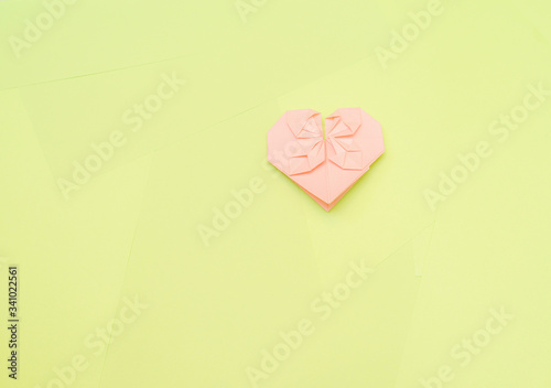 Origami pink heart on a green background, step by step instructions. as great idea for a hand made diy Valentine s Day, Mothers day gift. Step 25 finish