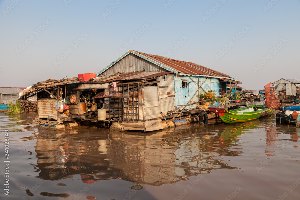 Floating House on Tonle Sap lake at sunset in Cambodia Floating House on Tonle Sap lake at sunset in Cambodia