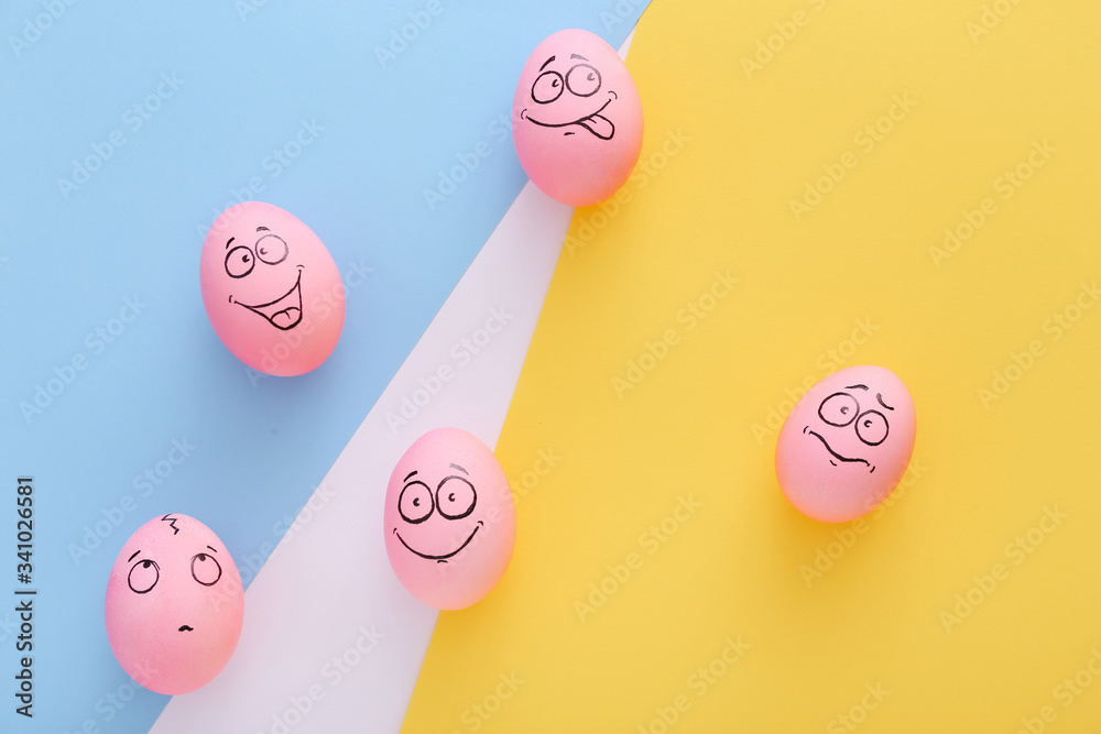 Funny pink eggs with face feeling on colorful background Funny pink eggs with face feeling on colorful background