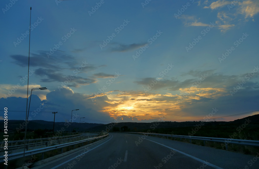 Sunset on the national highway in the Kassandra peninsula, Greece Sunset on the national highway in the Kassandra peninsula, Greece