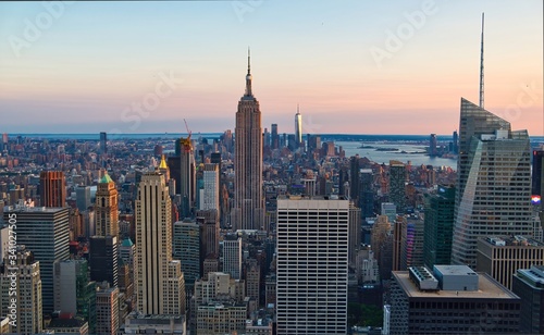 New York City Manhattan sunset skyline aerial view with office building skyscrapers and Hudson River. © othman