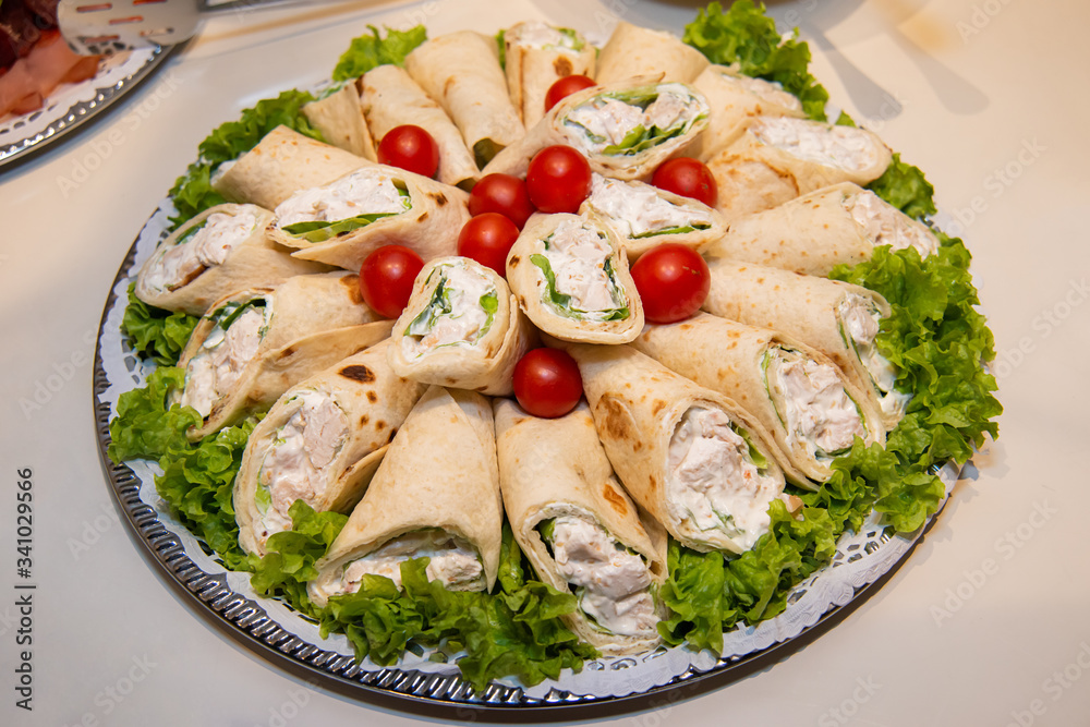 Tasty tortilla with salad and chicken meat