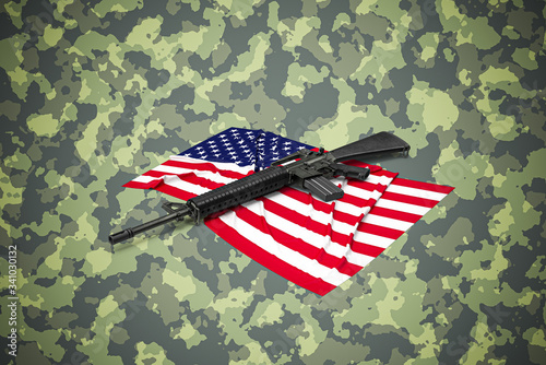 American caliber 5.56 mm rifle on camouflage background