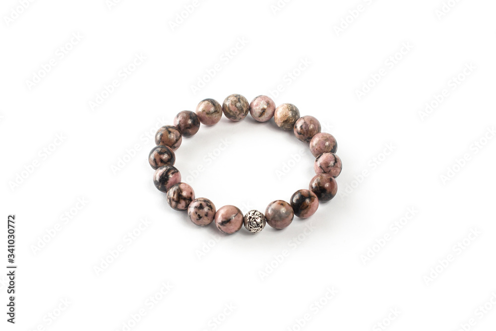 Rhodonite bracelet on a white background isolate Rhodonite bracelet on a white background isolate