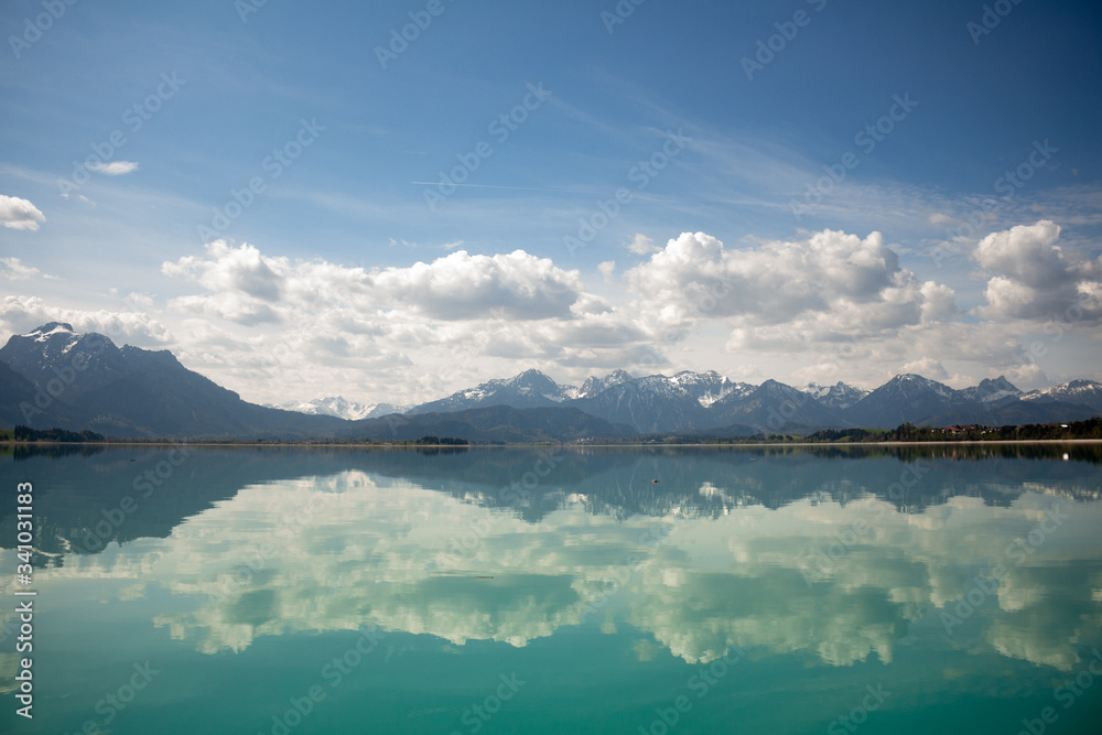 scenic view of the alps. Mountains reflecting in the water of the 