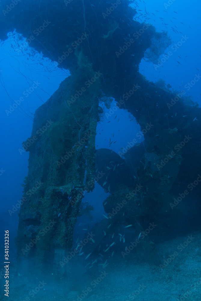 The propeller and rudder section of a sunken vessel that was separated from the rest of the ship by a significant explosion during conflict