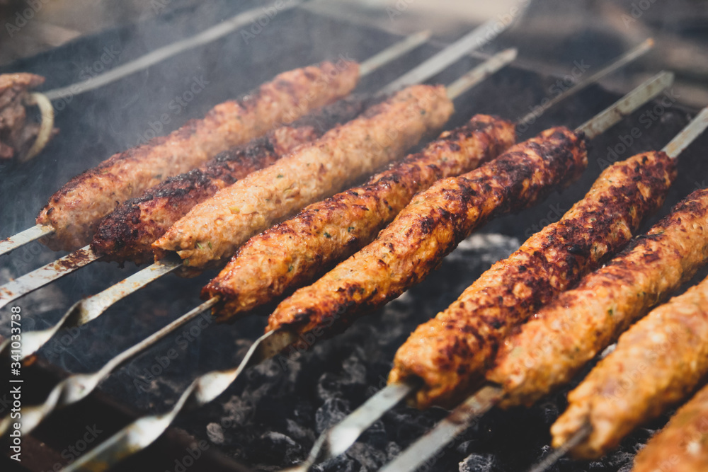BBQ Beef Kebabs on a Hot Grill Closeup. Arabian and Iranian kabab.