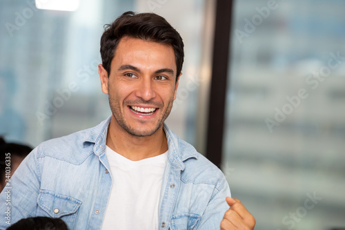 Handsome man smiling in the office, Feeling positive concept