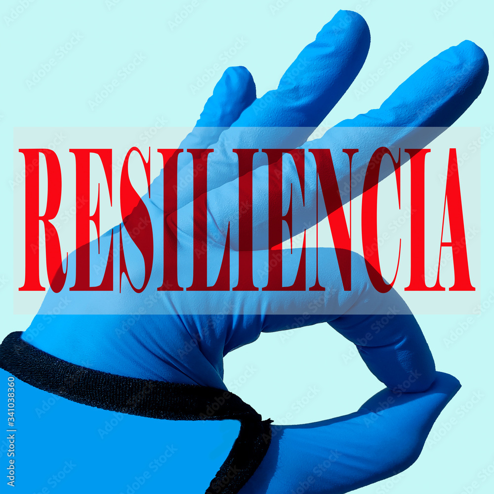 Φωτογραφία Mano con guante de látex haciendo el signo de acuerdo con la palabra resiliencia en color rojo y en idioma español