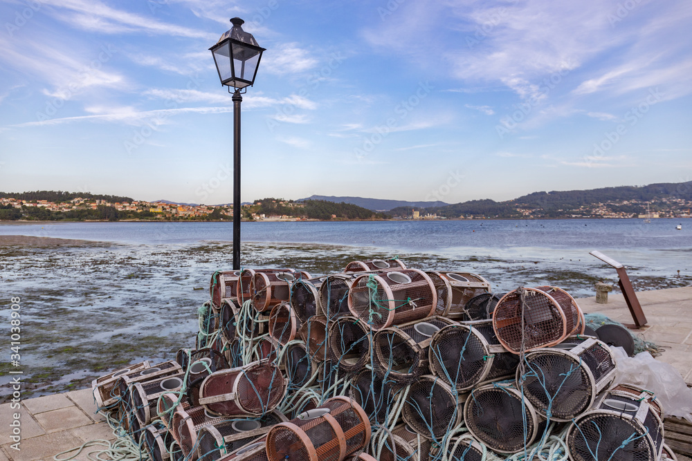 Φωτογραφία Fishing tools piled up on the dock of the fishing village named Combarro in Galicia, Spain