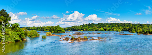 Photos Panoramic view from a boat to Iguazu River on shores with sub-tropical rainforest