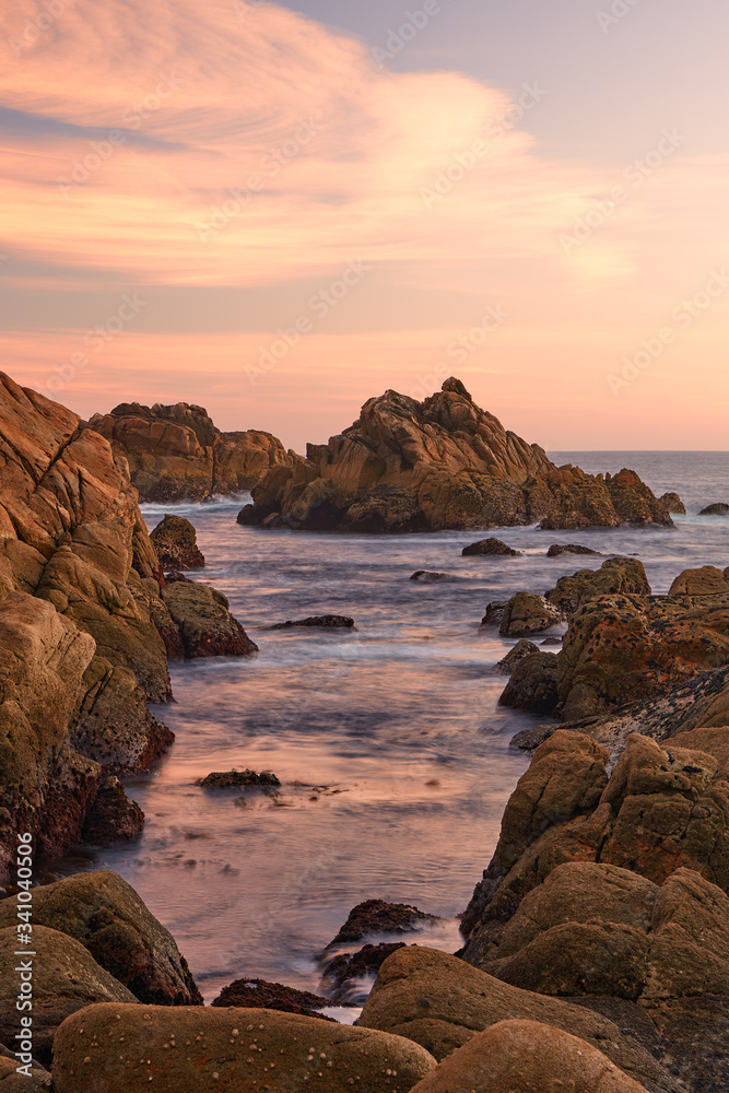 Sunset between the rocks of the Galician coast.