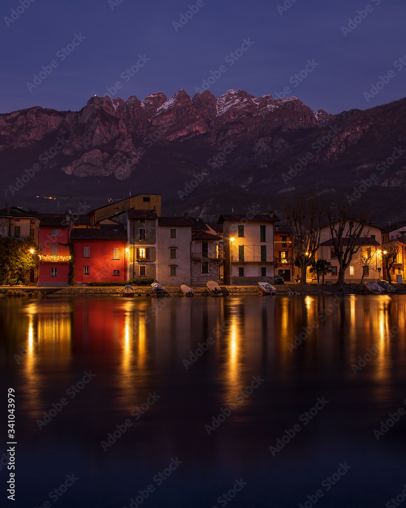 Fototapeta premium Spectacular night reflections of houses on the lake. 