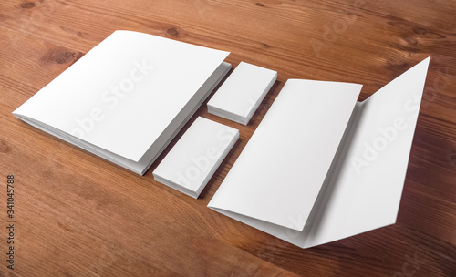 business card templates, catalog and booklet on a wooden table. Corporate Identity Presentation