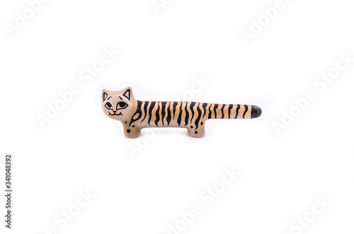 Clay red cat figurine on a white background