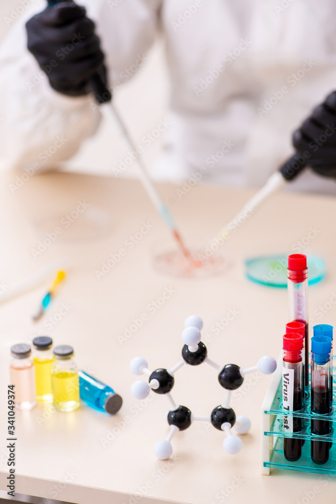 Doctor working in lab in coronavirus COVID-19 concept Doctor working in lab in coronavirus COVID-19 concept