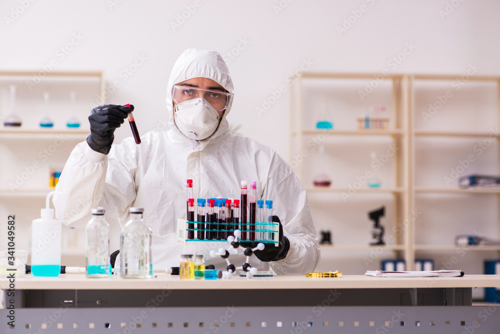 Doctor working in lab in coronavirus COVID-19 concept