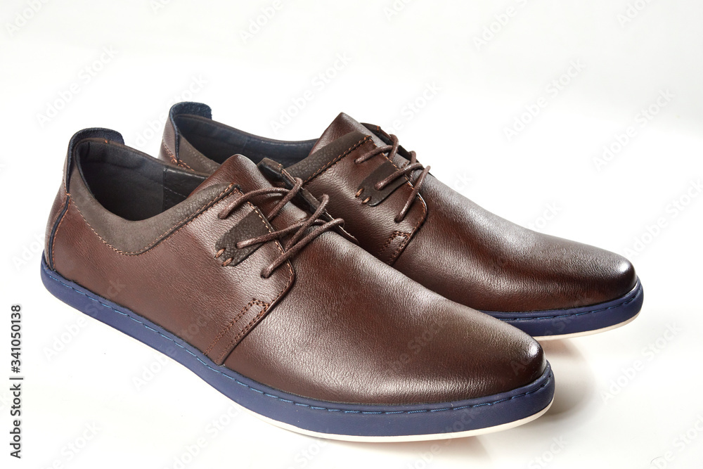 Men fashion brown shoe leather over white background. Pair casual stylish footwear. Men fashion brown shoe leather over white background. Pair casual stylish footwear.