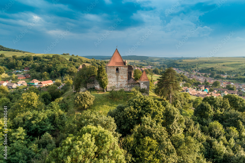 Aerial drone view of Slimnic Fortress (Stolzenburg), located on a Burgbasch hill in  Sibiu region, Romania