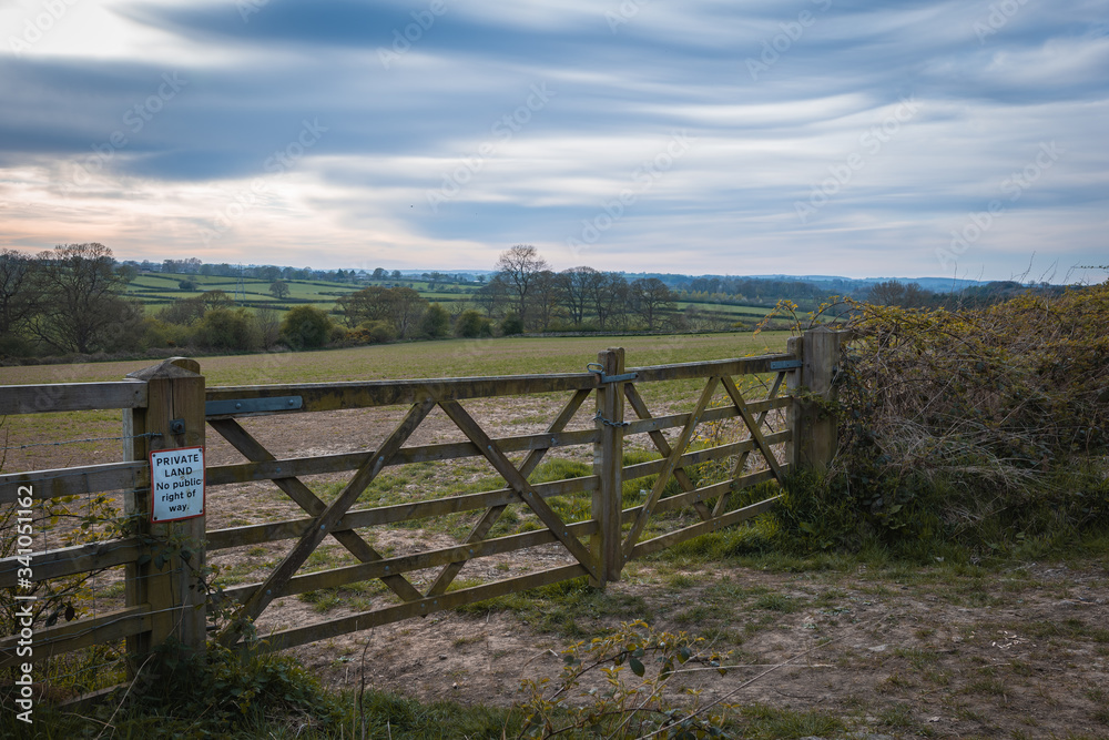 Old Rustic Farm Gate in front of a beautiful landscape of the Yorkshire countryside at dusk Old Rustic Farm Gate in front of a beautiful landscape of the Yorkshire countryside at dusk