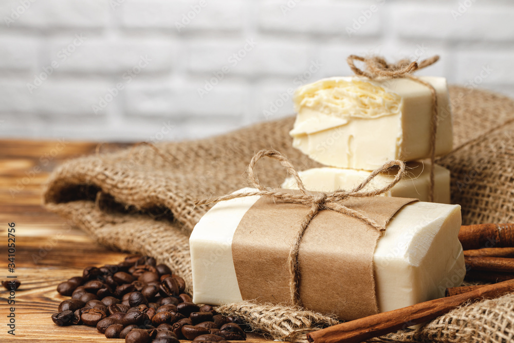 Composition with grains of coffee, soap on the wooden table, close up Composition with grains of coffee, soap on the wooden table, close up