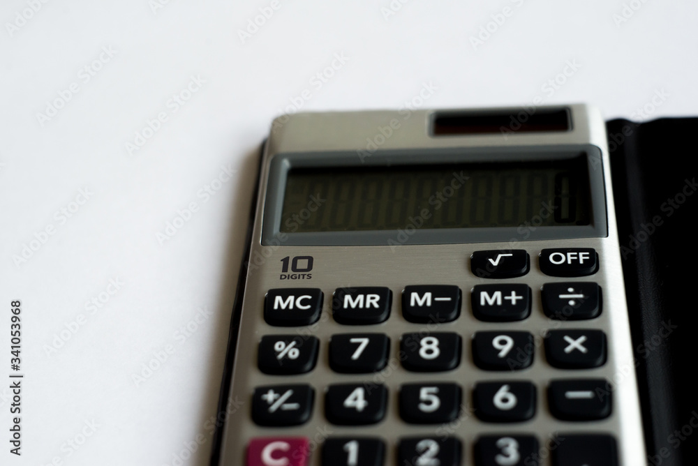calculator on a white background, one hundred dollars usa calculator on a white background, one hundred dollars usa