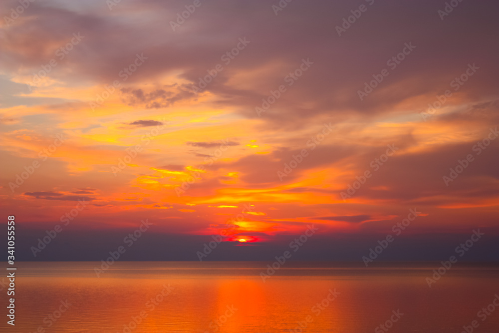 Background of colorful sky concept: Dramatic sunset with orange color sky and clouds. Background of colorful sky concept: Dramatic sunset with orange color sky and clouds.