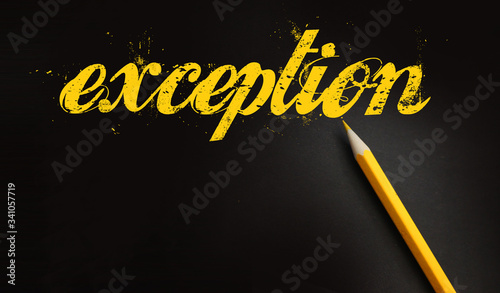 Photography Exception word written with yellow pencil on black