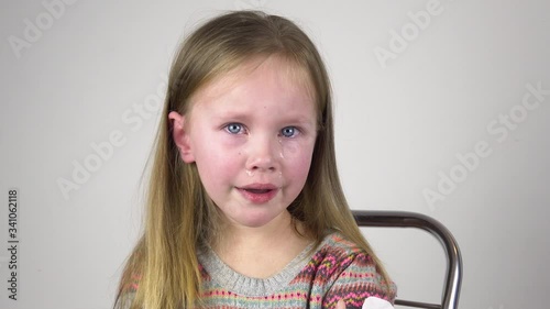 Portrait crying little girl . tears streaming down her face. Real human emotions. Children face wet from tears. 4k
