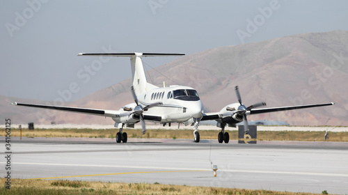 Tableau sur toile White Private Plane Taxi on Runway