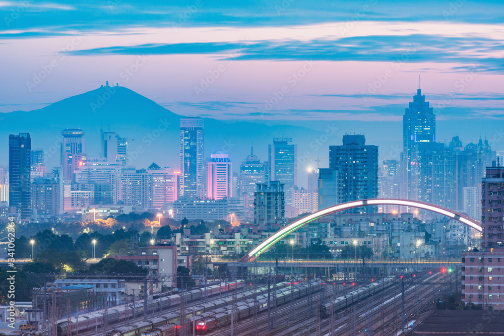 Cityscape and railway station at evening time. Shenzhen. Cityscape and railway station at evening time. Shenzhen.